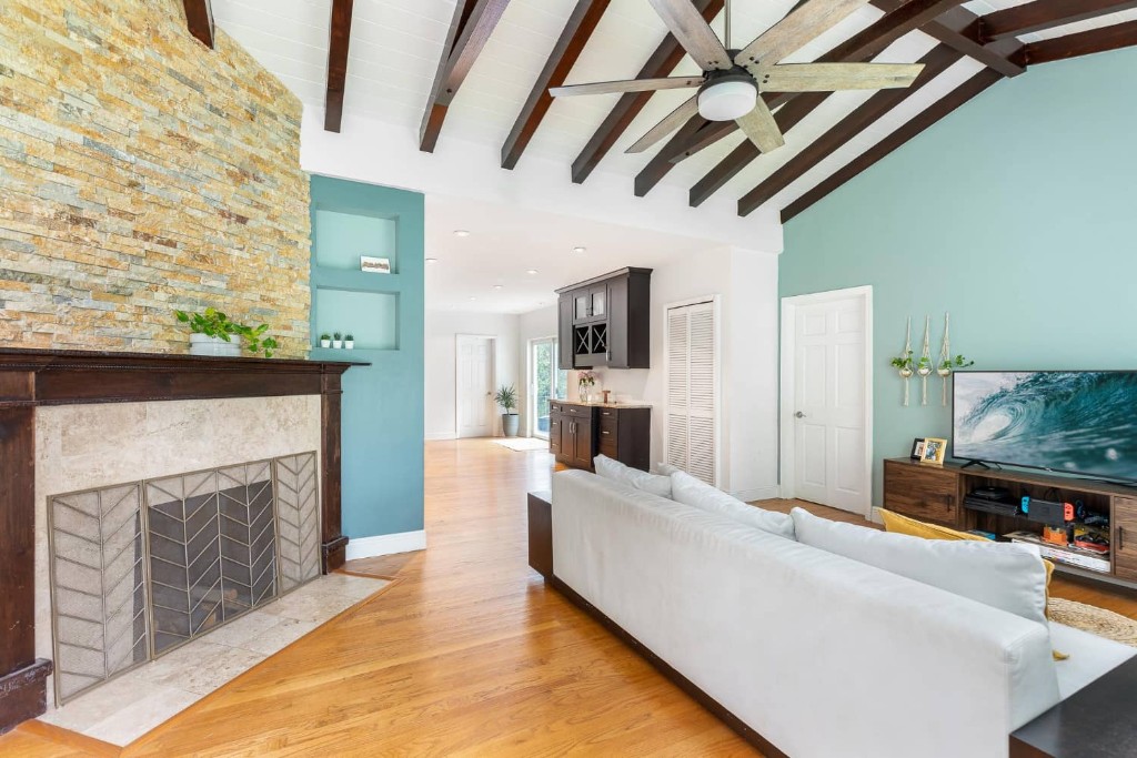 Modern Florida home interior with fireplace, living area, and open layout